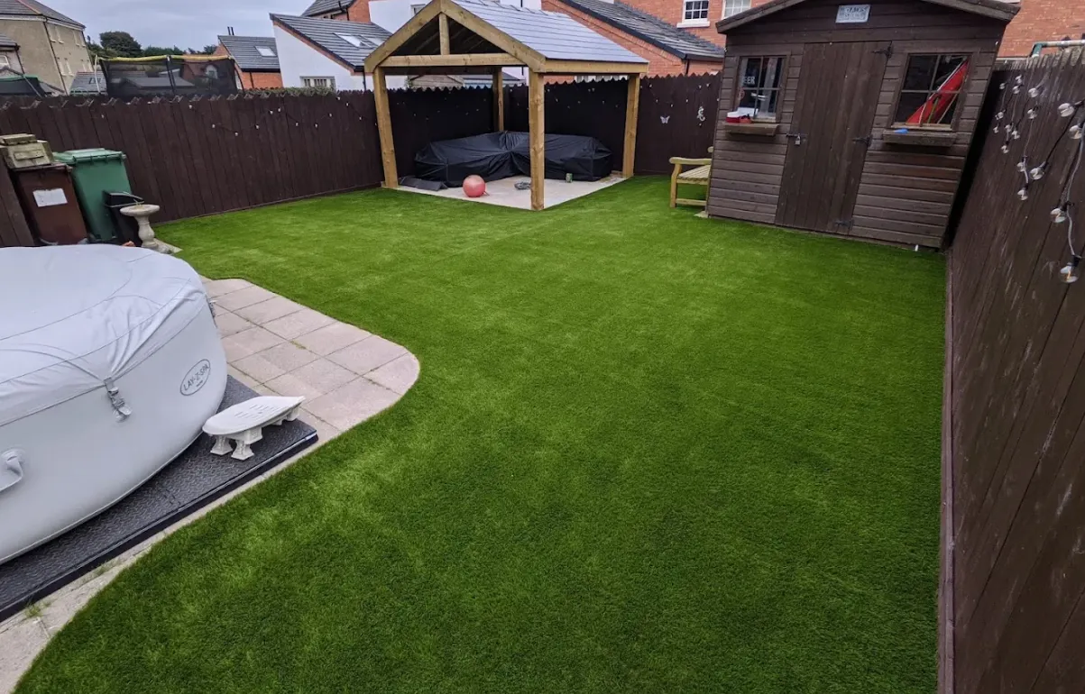 Artificial grass lawn completed by Esher Driveways & Patios